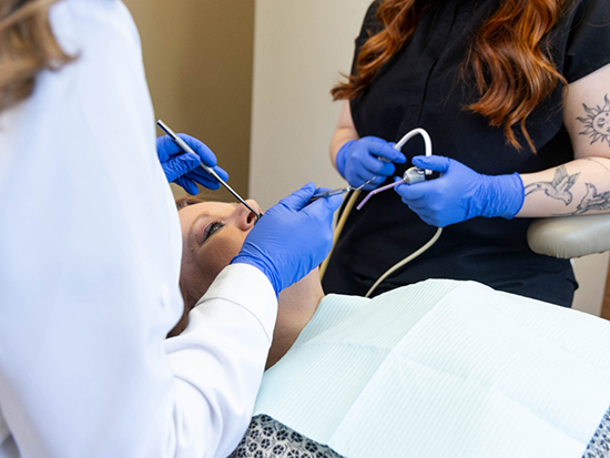 Female dental patient receiving restorative dentistry in El Reno