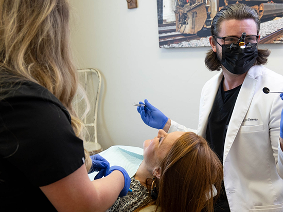 Dental patient being treated by two dentists