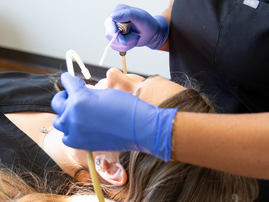 Dental patient receiving gum disease treatment in El Reno