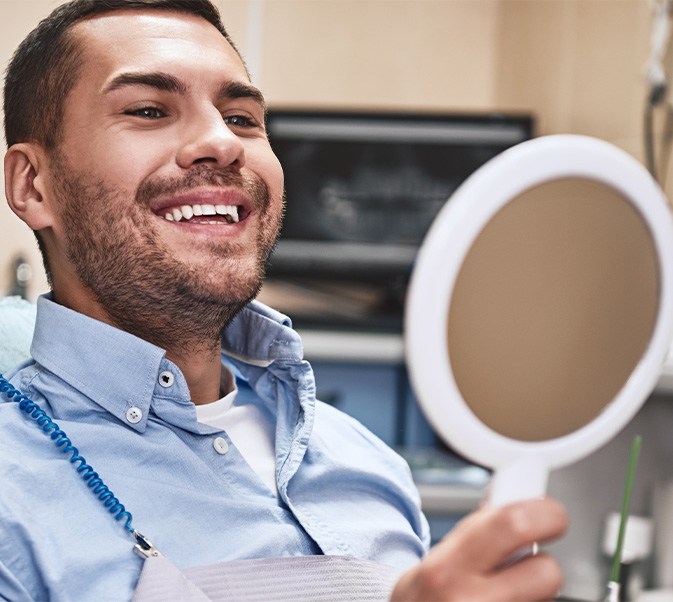 Smiling male dental patient