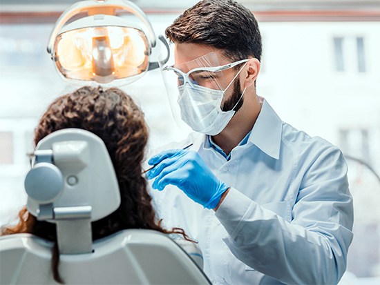 Dentist performing a checkup