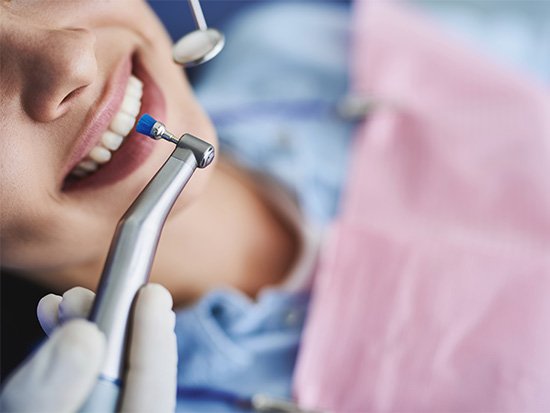 Patient receiving dental cleaning