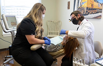 Dentists treating a patient with dental services in El Reno