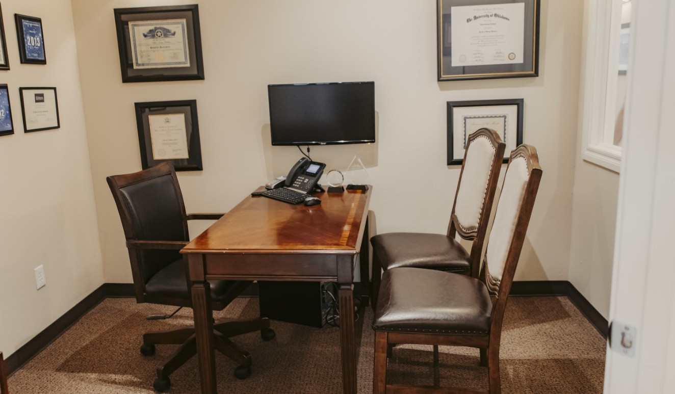 Three chairs sitting at table with phone