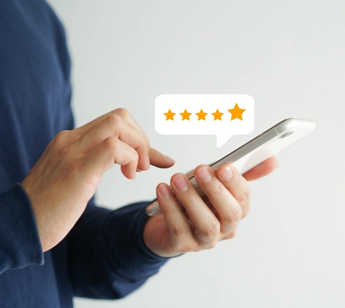 Dental patient leaving a five star review on phone