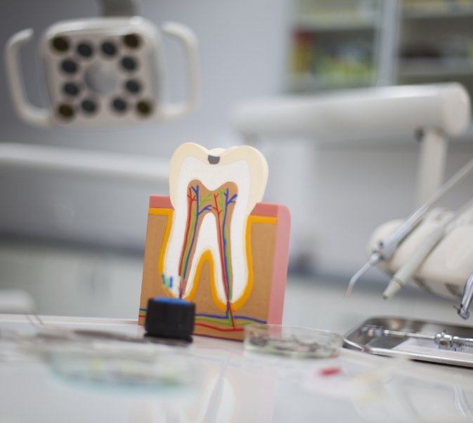 Model of a tooth sitting on crowded table