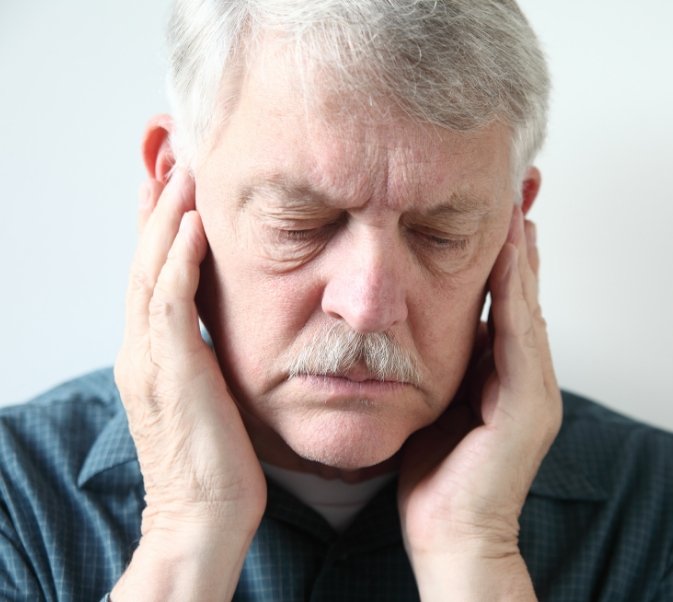 Senior man with jaw pain who needs TMJ treatment in El Reno