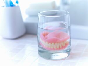 dentures in a glass of water 